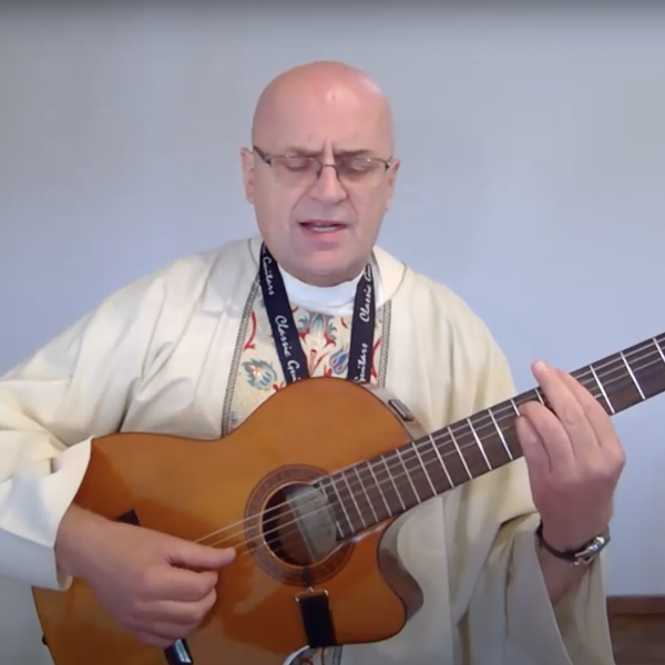 Fr Zbigniew Playing Guitar